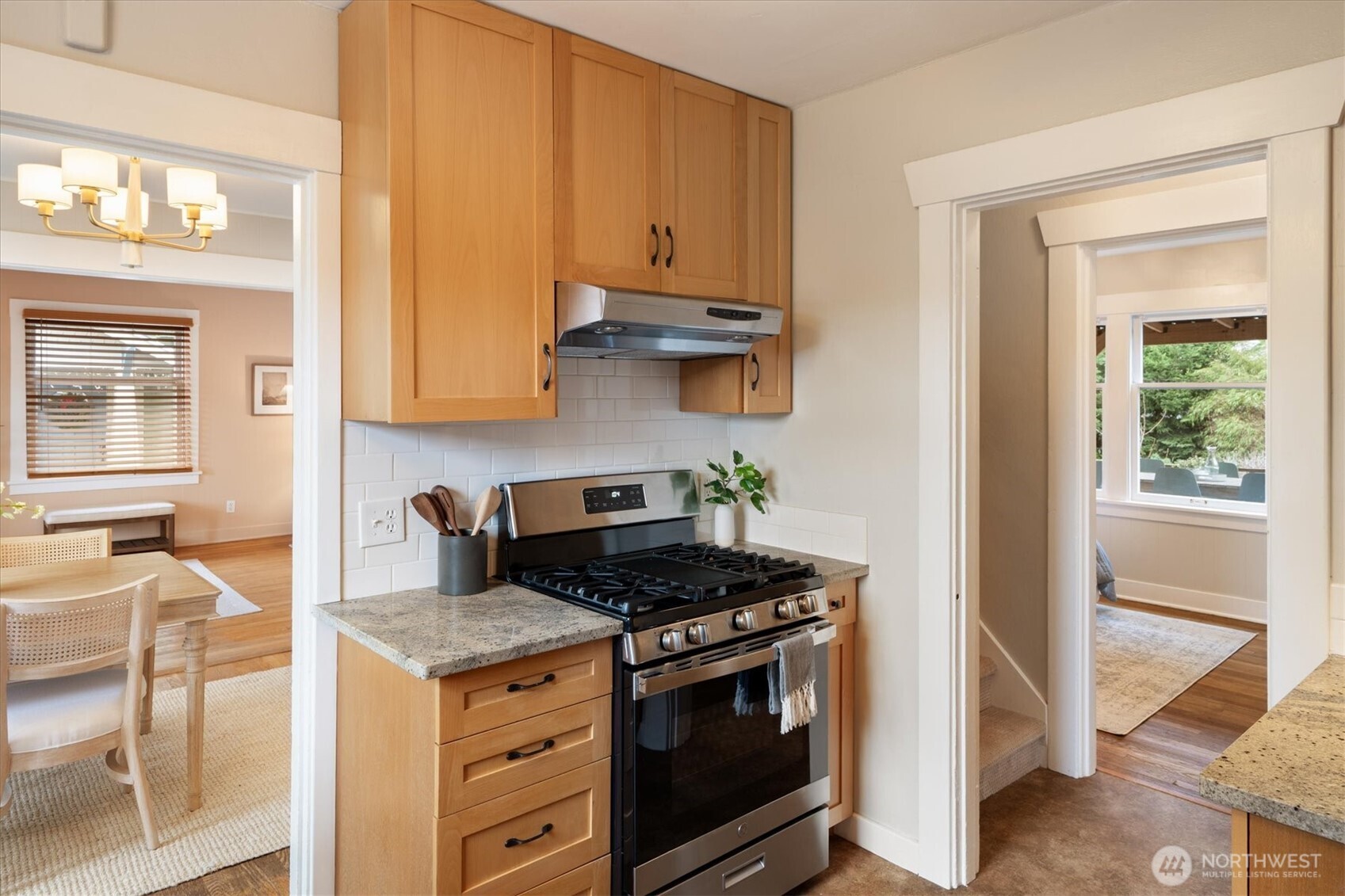740 North 82nd Street Seattle, WA 98103 - Photo 11 of 36 a kitchen with stainless steel appliances granite countertop a stove and a microwave