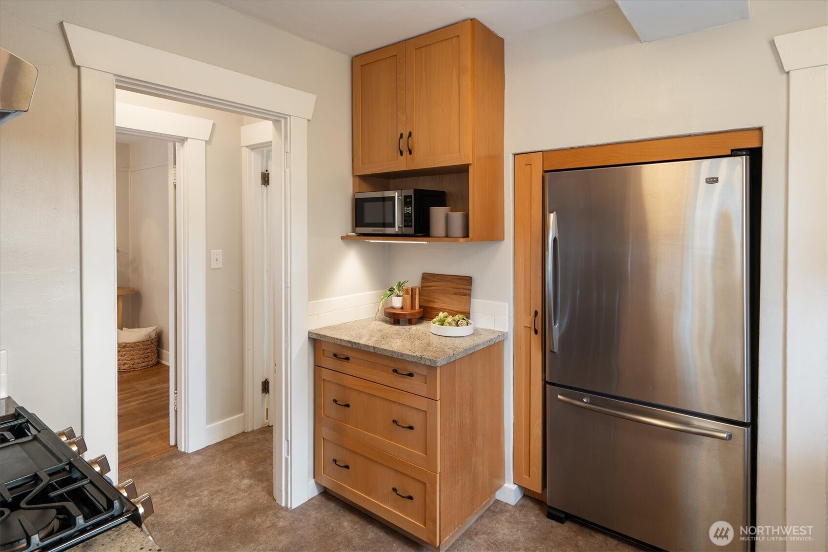 740 North 82nd Street Seattle, WA 98103 - Photo 12 of 36 a kitchen with stainless steel appliances granite countertop a refrigerator and a stove