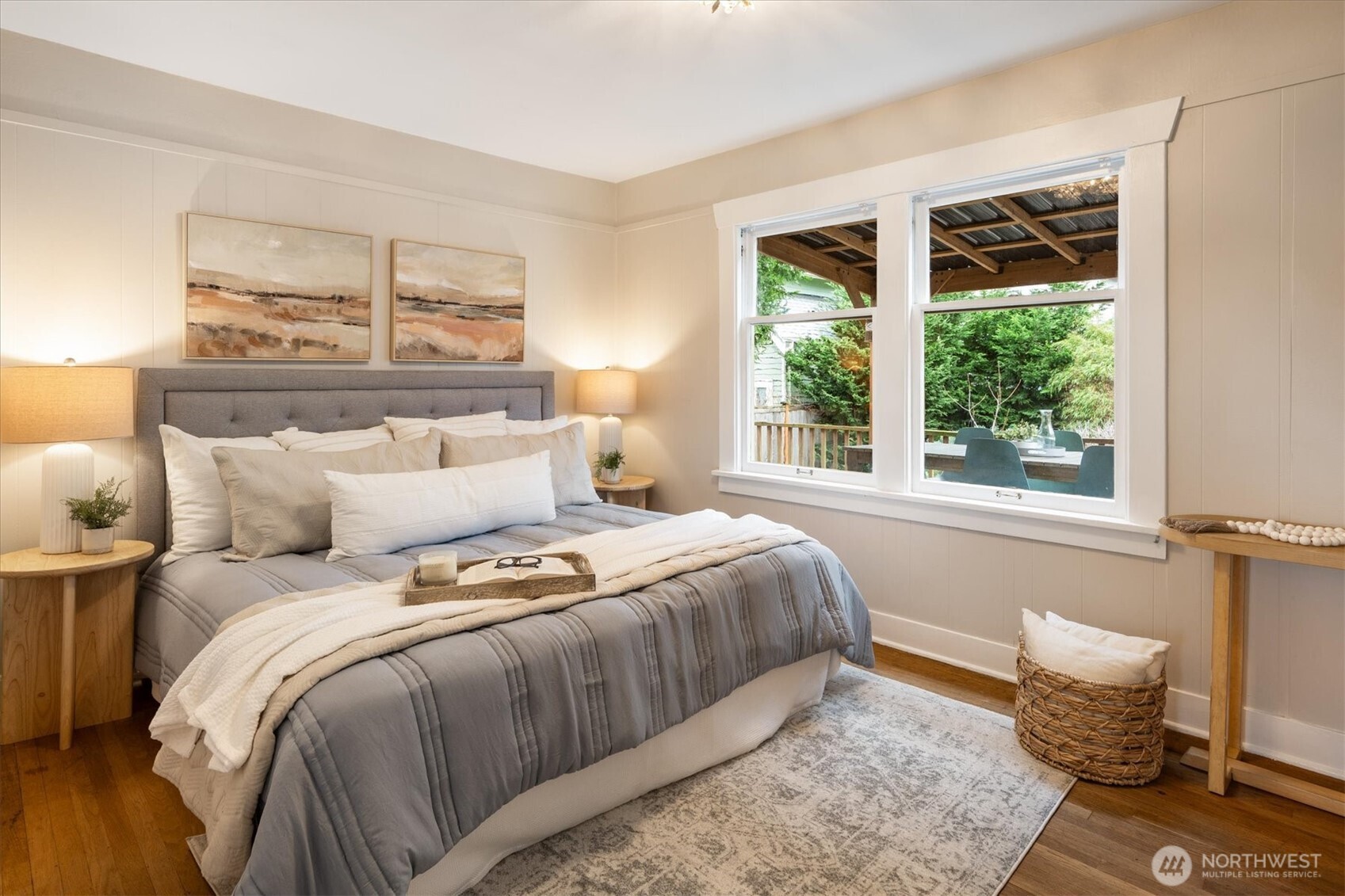 740 North 82nd Street Seattle, WA 98103 - Photo 13 of 36 a bedroom with a bed and wooden floor