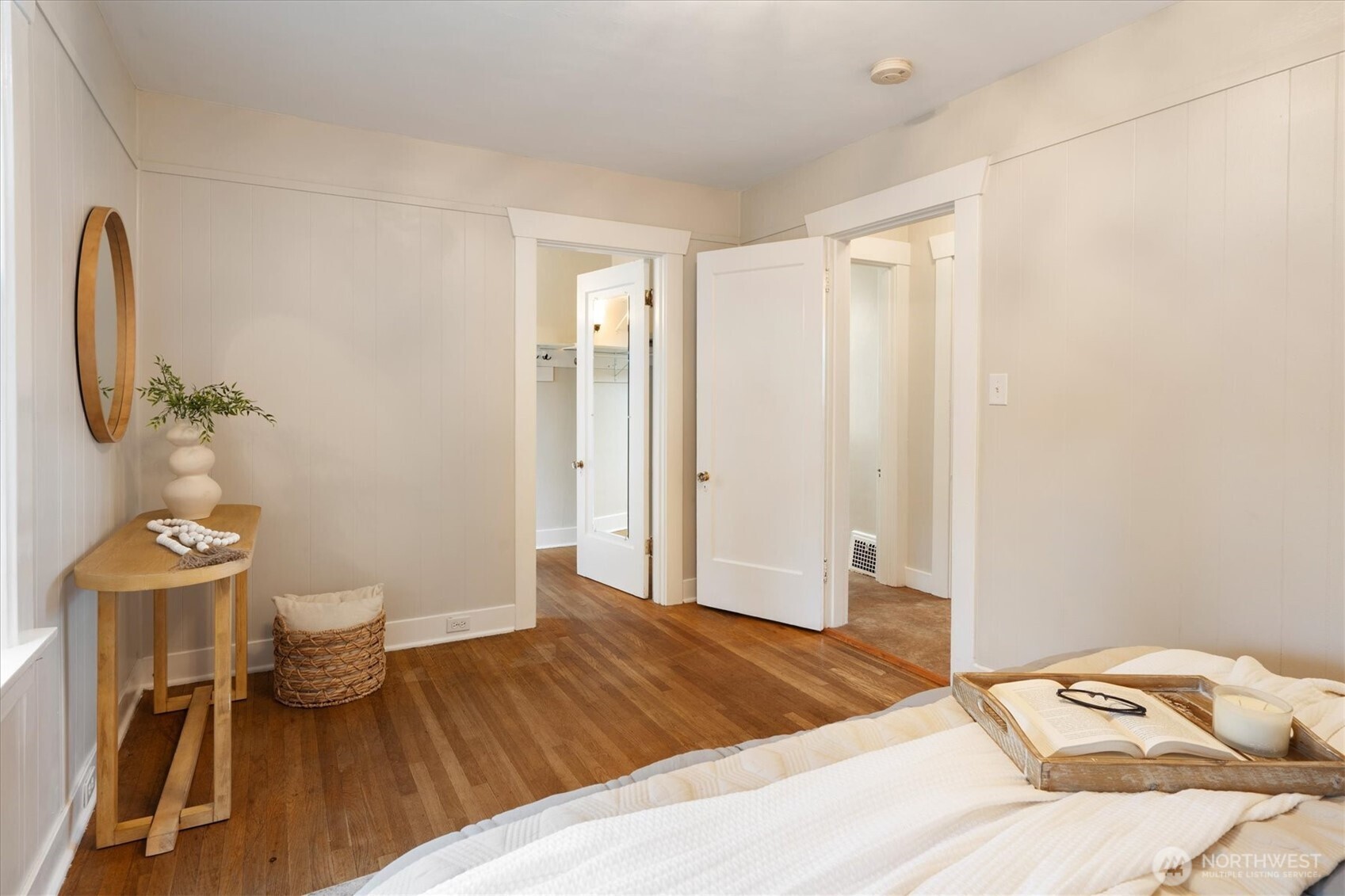 740 North 82nd Street Seattle, WA 98103 - Photo 14 of 36 a bedroom with a bed and a chandelier