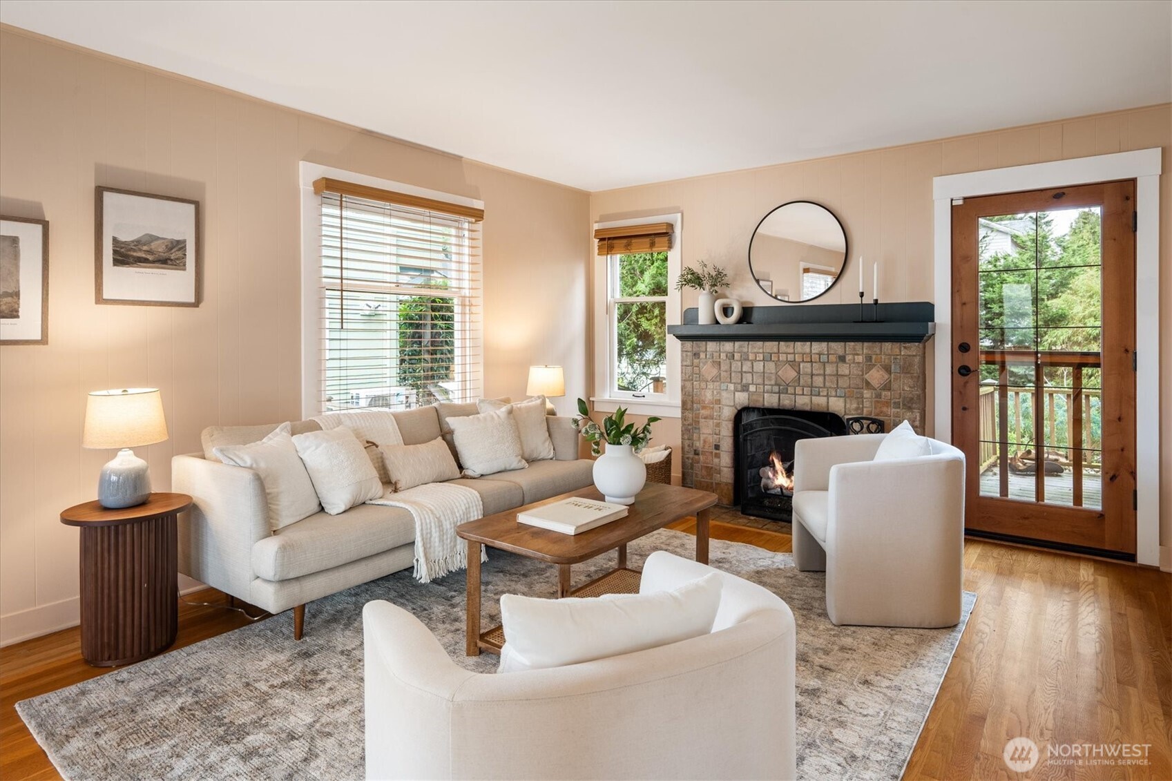 740 North 82nd Street Seattle, WA 98103 - Photo 6 of 36 a living room with furniture a fireplace and a floor to ceiling window