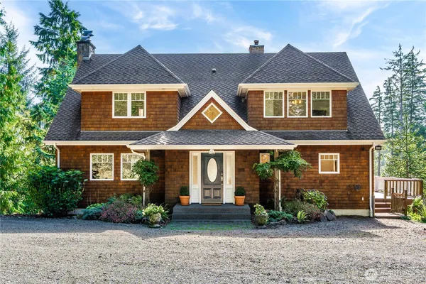 a front view of a house with garden