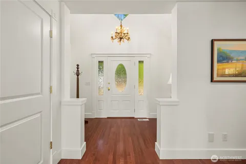 a view of entryway with wooden floor