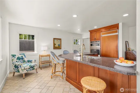 a very nice looking dining room with a table and chairs