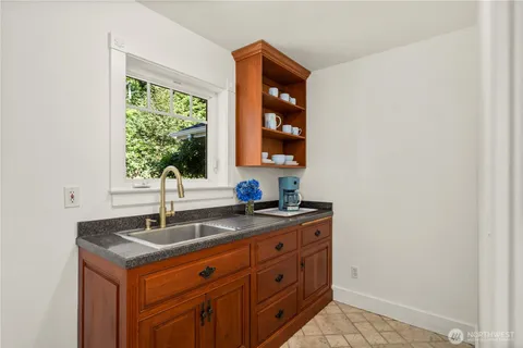 a kitchen with a sink and a window