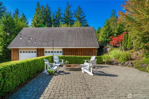 a view of a patio with table and chairs and potted plants