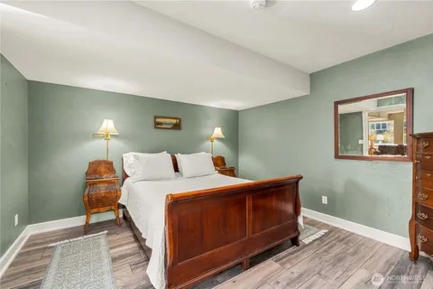 a bedroom with a bed and a lamp