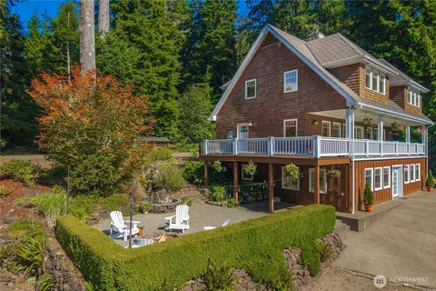 a front view of a house with a yard table and chairs