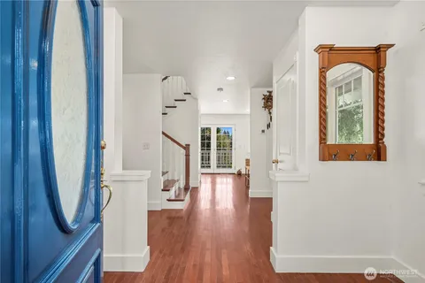 a view of front door with wooden floor