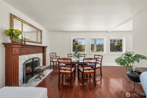 a view of a livingroom with furniture and a fireplace
