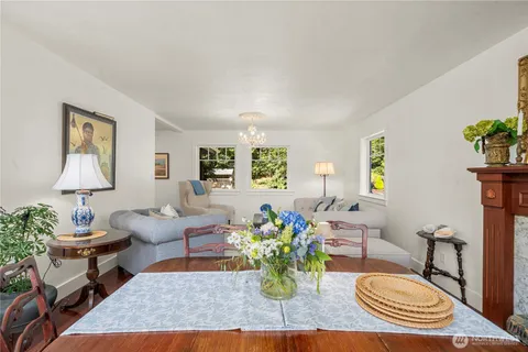 a living room with furniture potted plant and a window