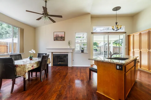 a living room with fireplace furniture and a wooden floor