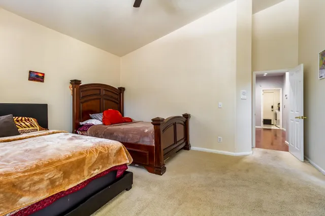 a spacious bathroom with a tub sink and mirror