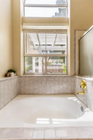 a view of walk in closet with clothes