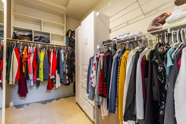 a bedroom with a bed and a television