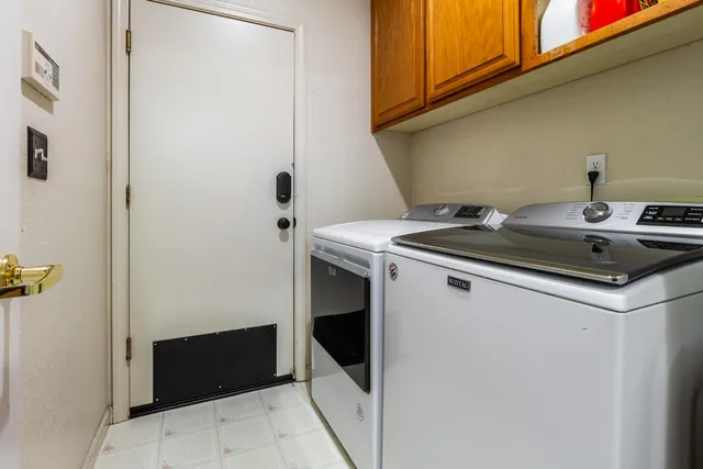 a view of a house with a yard and balcony