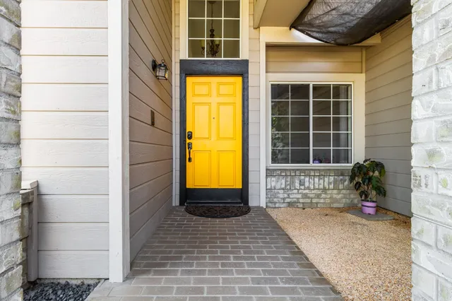 a view of a house with a door and a window