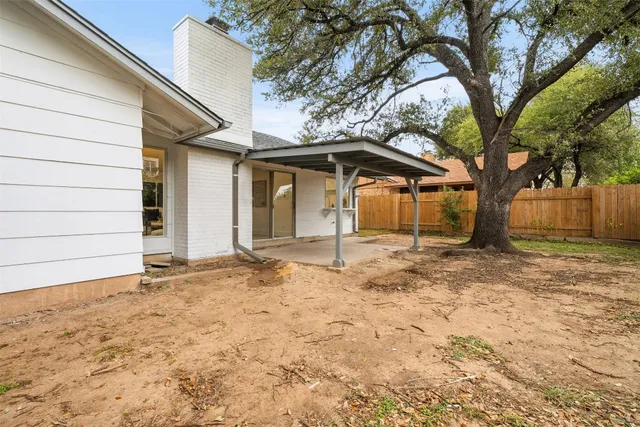 a view of a house with a snow in the yard