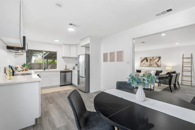 a kitchen with refrigerator and window