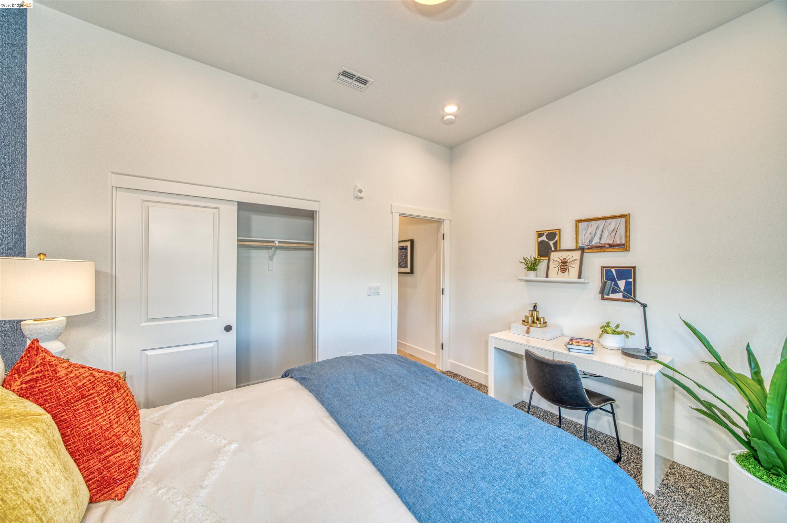 28951 Parkridge Loop, Unit 87 Hayward, CA 94544 - Photo 11 of 23 a bedroom with a bed and a desk in it