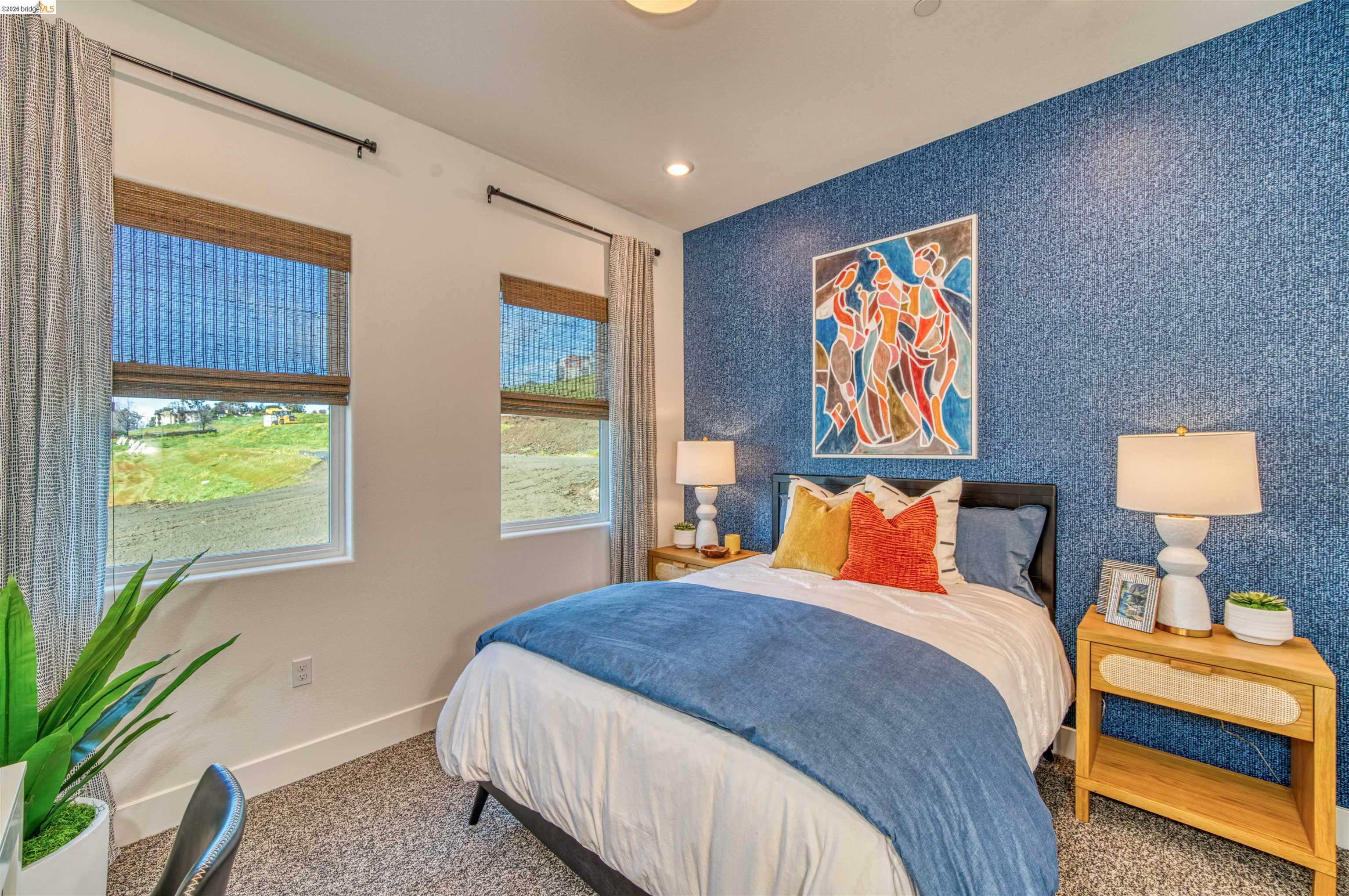 28951 Parkridge Loop, Unit 87 Hayward, CA 94544 - Photo 12 of 23 a bedroom with a bed and a painting on the wall