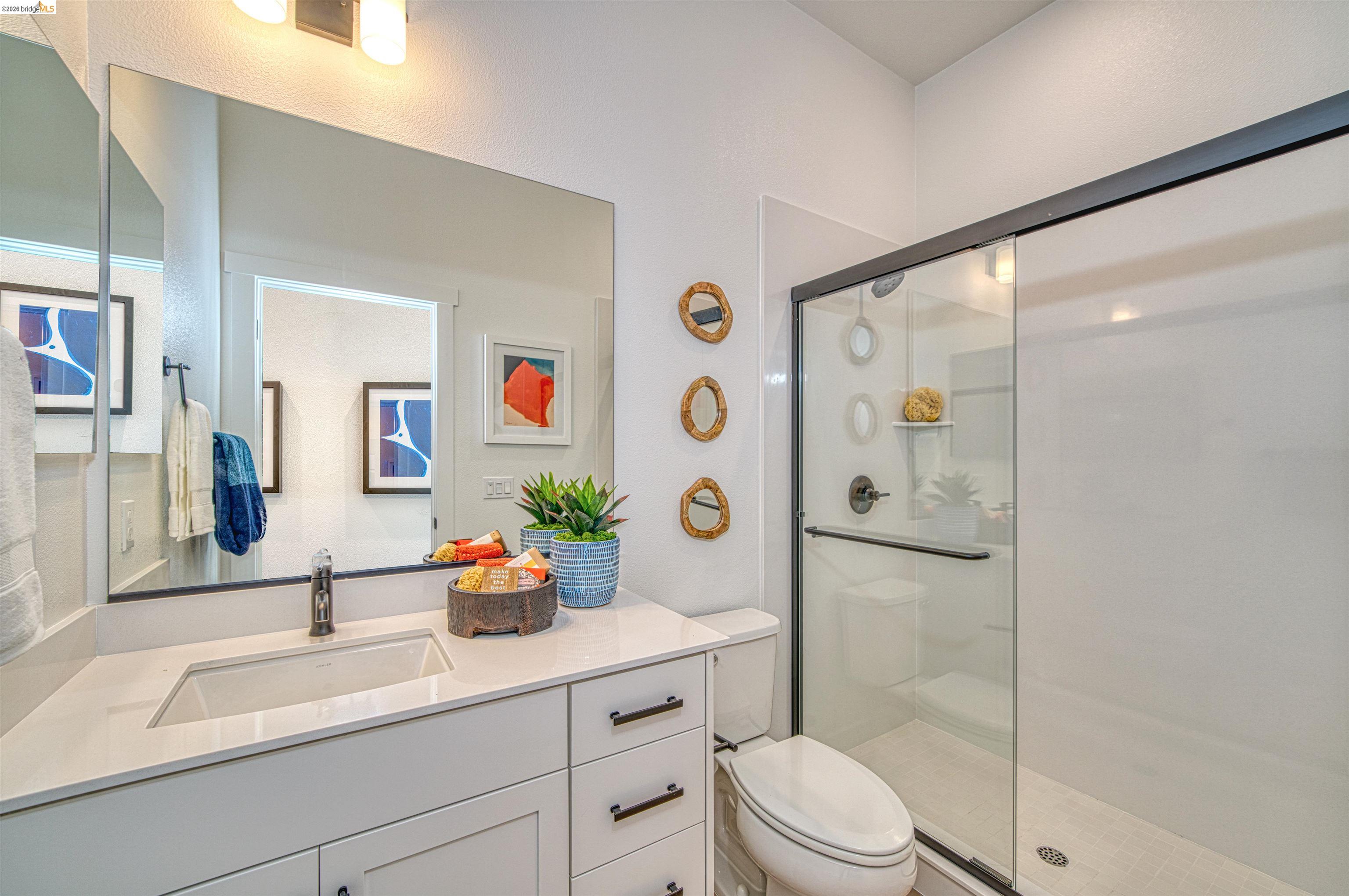 28951 Parkridge Loop, Unit 87 Hayward, CA 94544 - Photo 13 of 23 a bathroom with a sink a toilet and shower