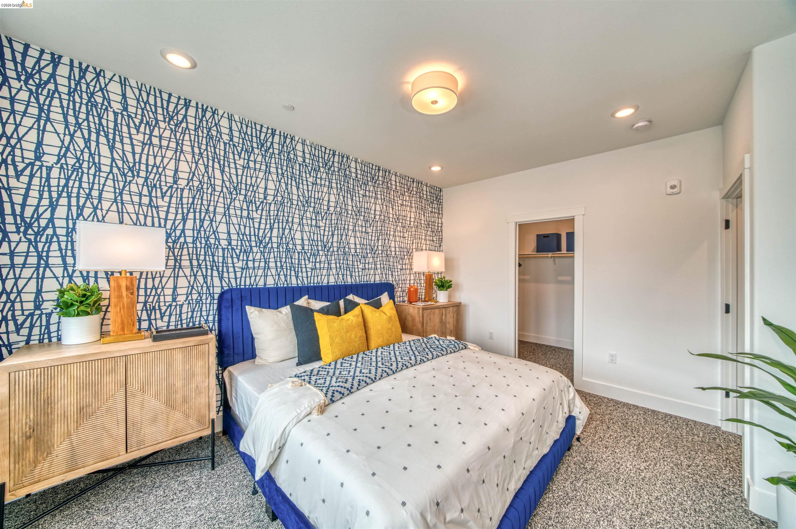 28951 Parkridge Loop, Unit 87 Hayward, CA 94544 - Photo 21 of 23 a bedroom with a bed and a lamp