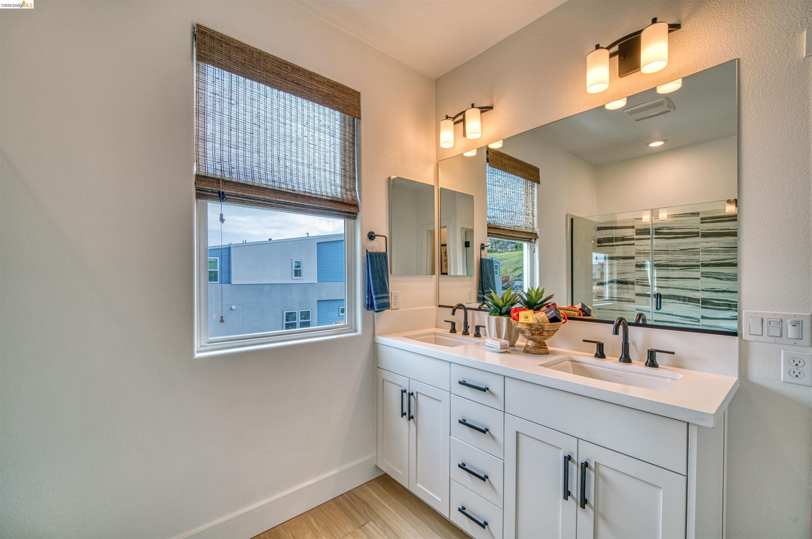 28951 Parkridge Loop, Unit 87 Hayward, CA 94544 - Photo 23 of 23 a bathroom with 2 sink and a mirror