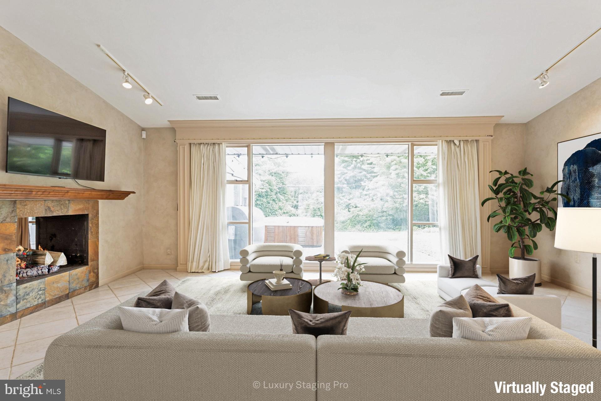 7920 Long Meadow Road Baltimore, MD 21208 - Photo 11 of 40 a living room with furniture and a large window