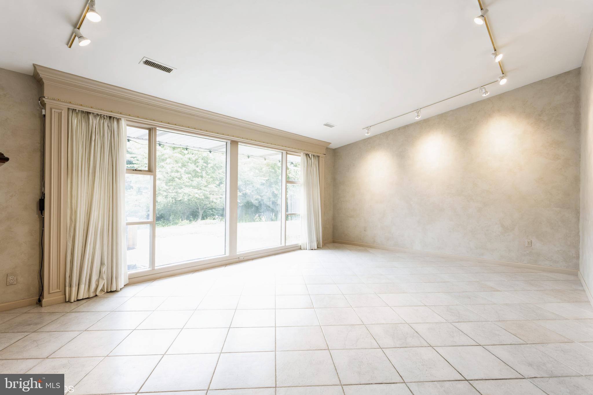 7920 Long Meadow Road Baltimore, MD 21208 - Photo 13 of 40 a view of an empty room with a window