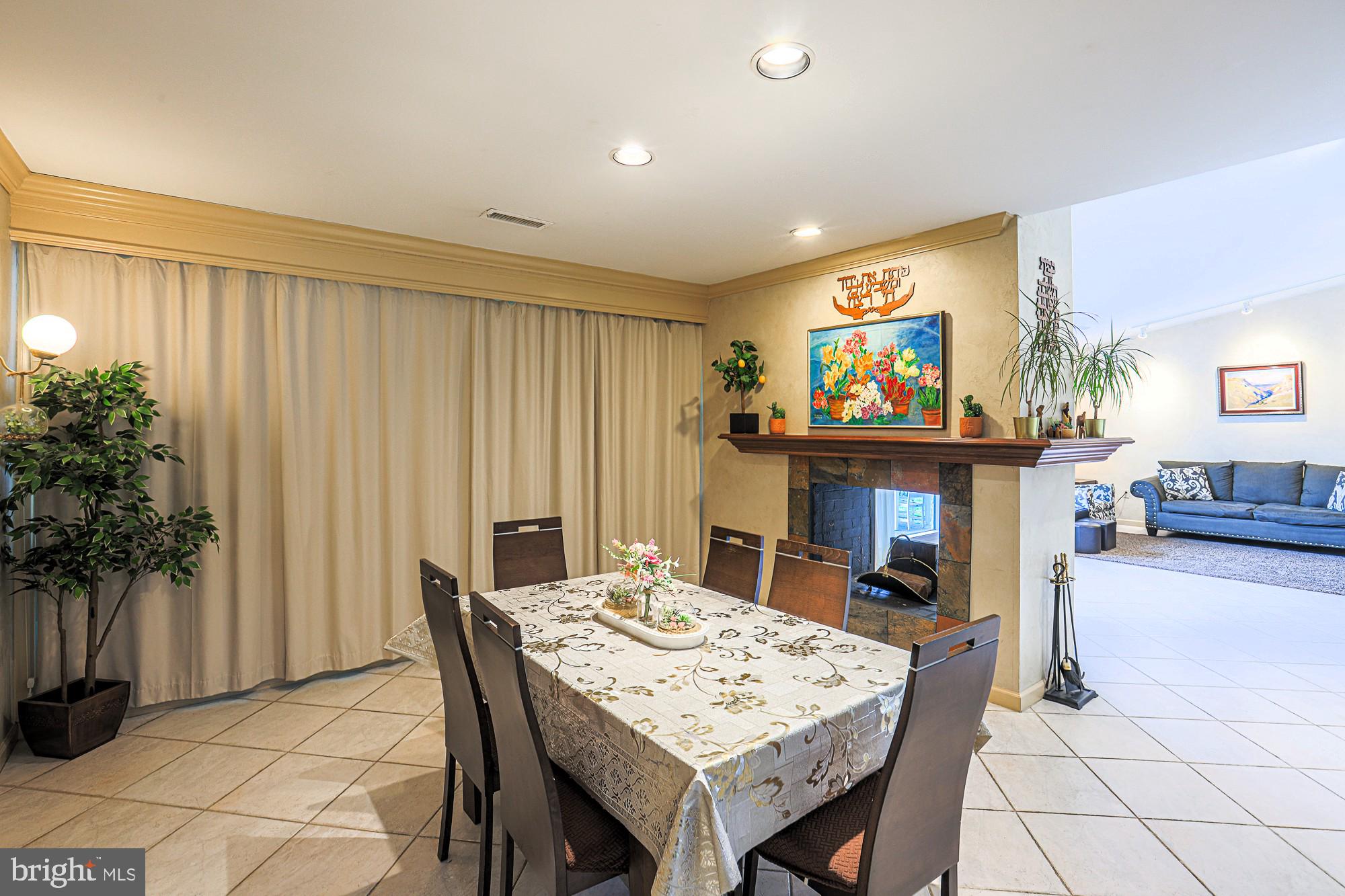 7920 Long Meadow Road Baltimore, MD 21208 - Photo 15 of 40 a view of a dining room with furniture window and wooden floor
