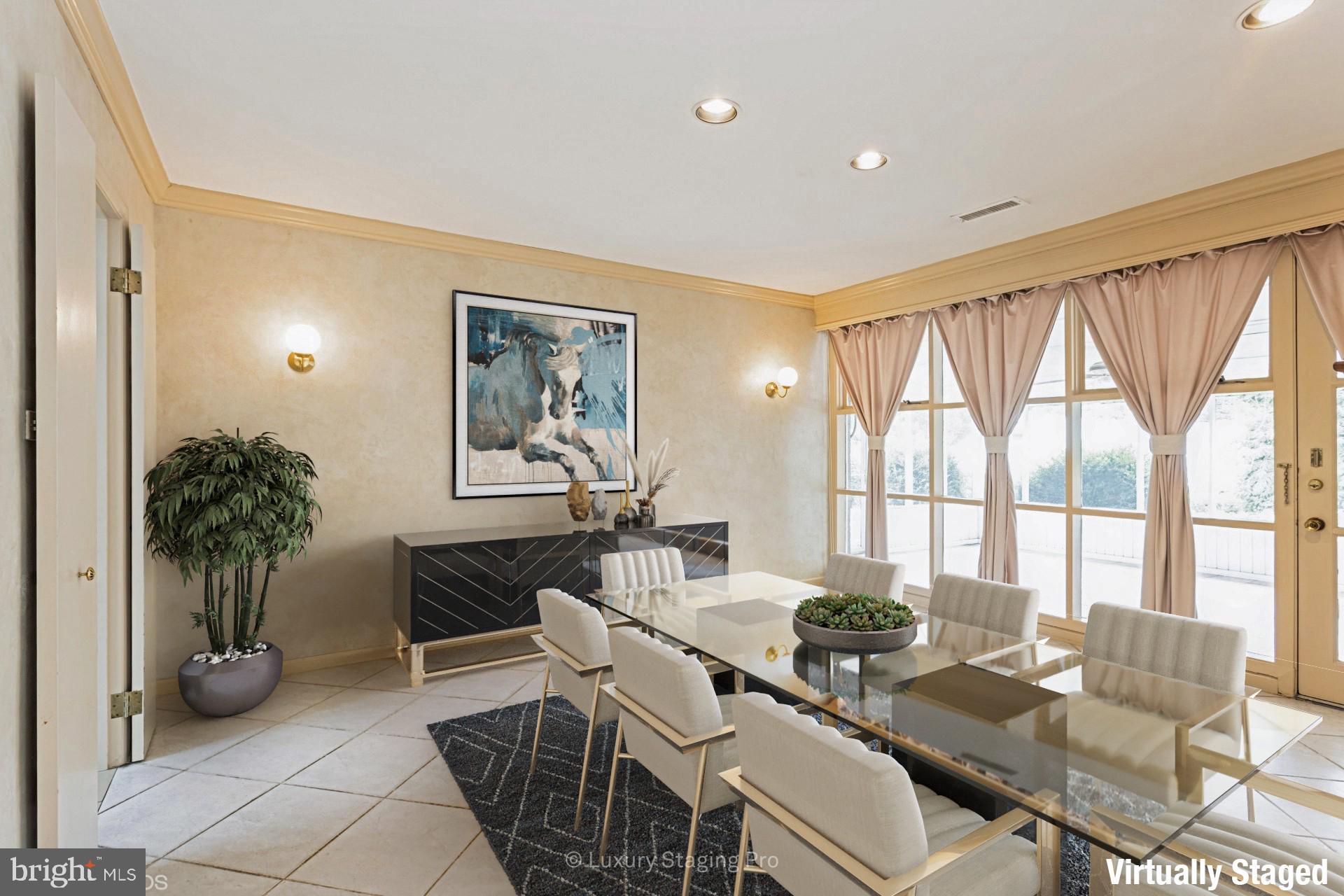 7920 Long Meadow Road Baltimore, MD 21208 - Photo 16 of 40 a living room with furniture and large windows