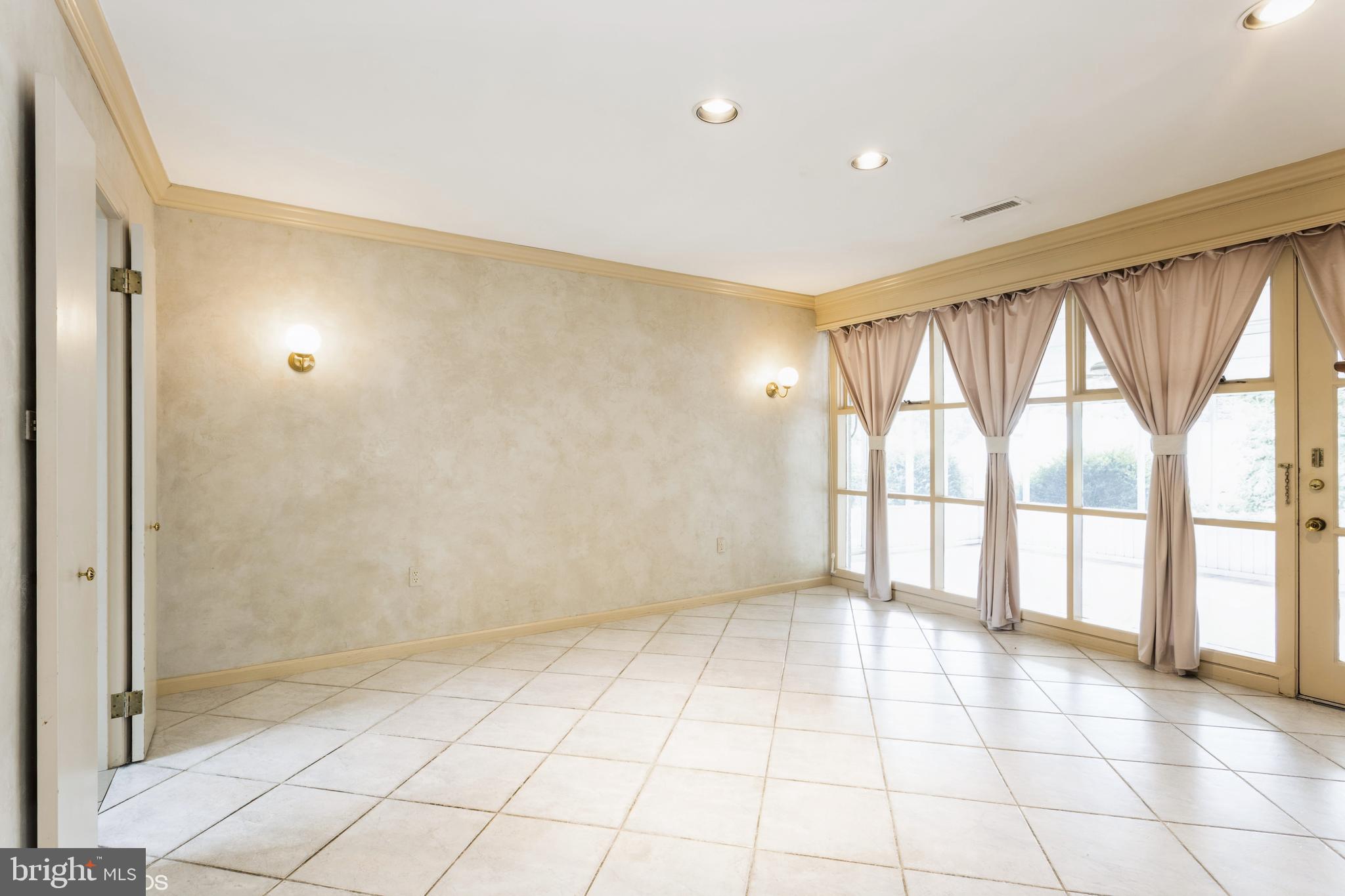 7920 Long Meadow Road Baltimore, MD 21208 - Photo 17 of 40 a view of an empty room with a window