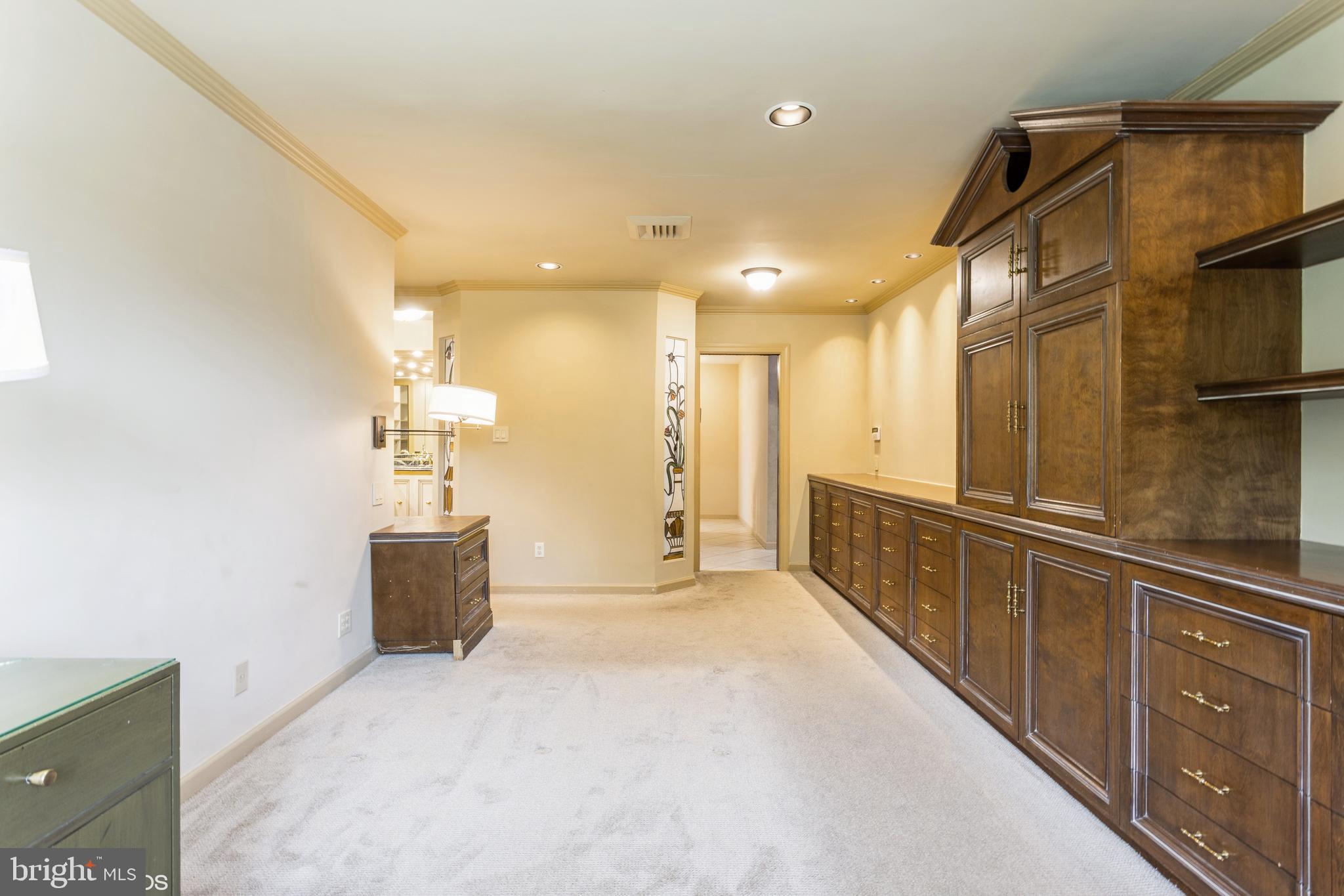 7920 Long Meadow Road Baltimore, MD 21208 - Photo 21 of 40 a view of a hallway with wooden cabinets