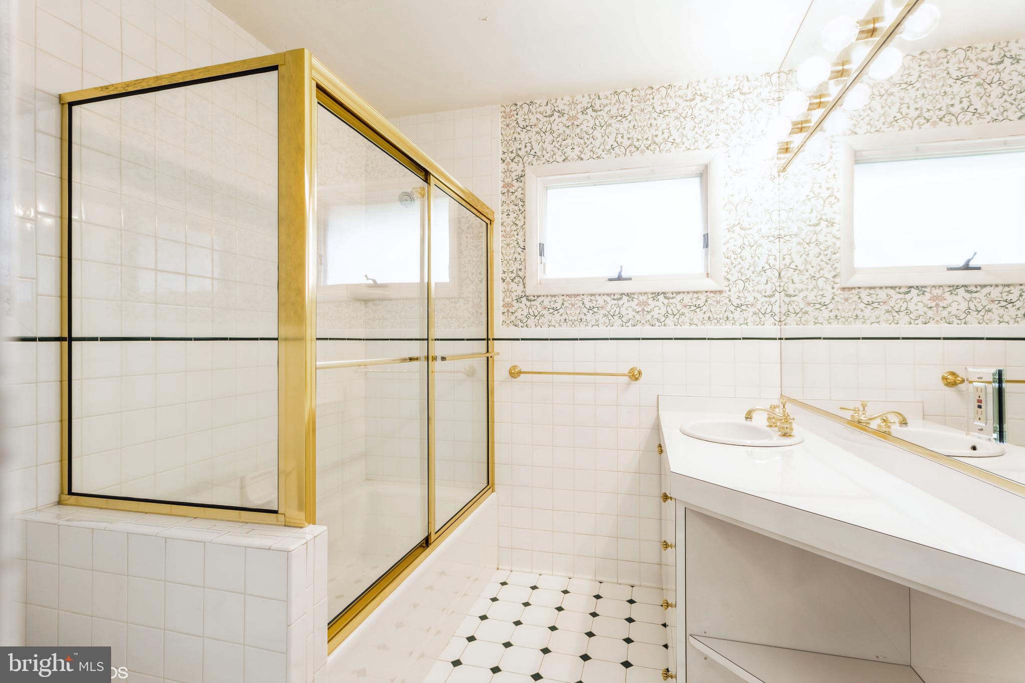 7920 Long Meadow Road Baltimore, MD 21208 - Photo 26 of 40 a bathroom with a sink and a mirror