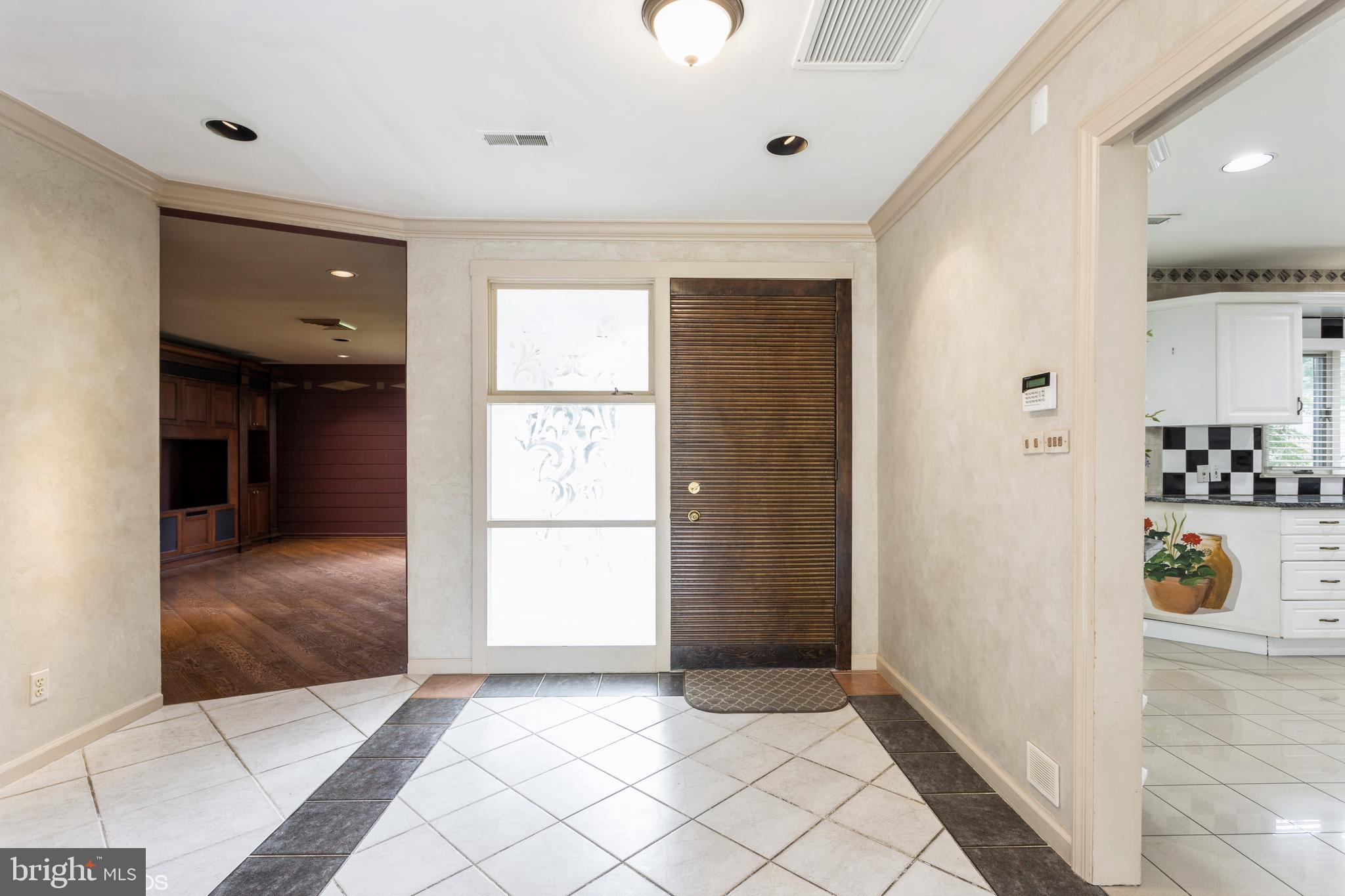 7920 Long Meadow Road Baltimore, MD 21208 - Photo 4 of 40 a view of entryway with a livingroom and natural light