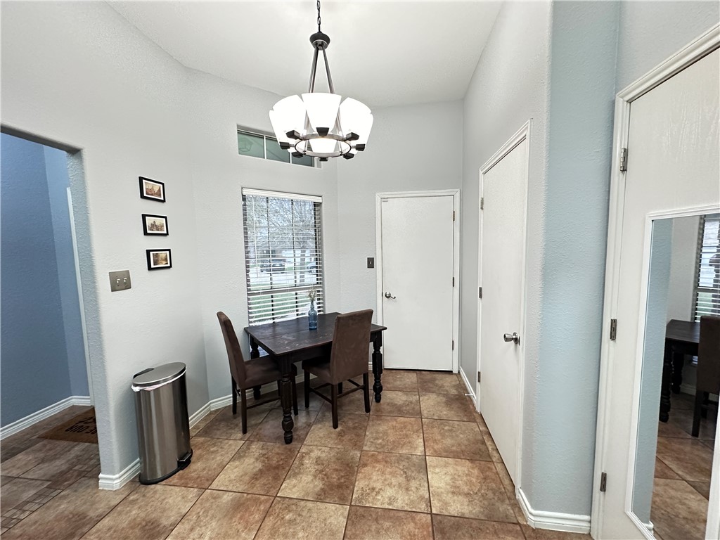 2106 Brook Lane Kingsville, TX 78363 - Photo 13 of 38 a view of a dining room with furniture window and outside view