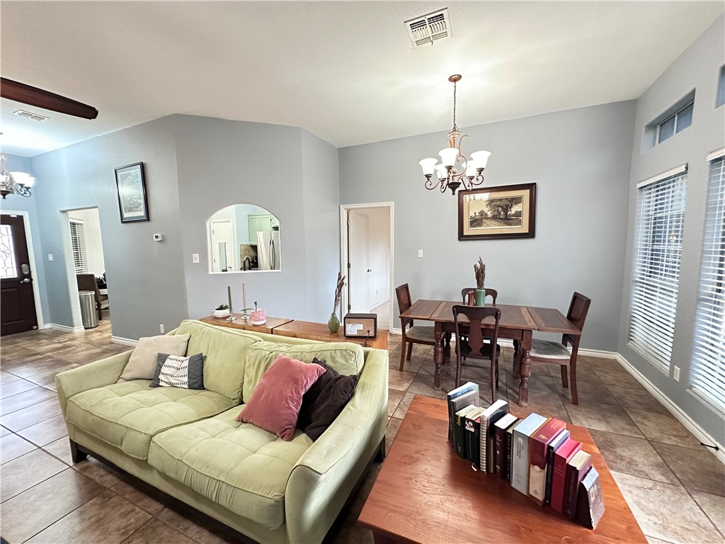 2106 Brook Lane Kingsville, TX 78363 - Photo 18 of 38 a living room with furniture and a chandelier