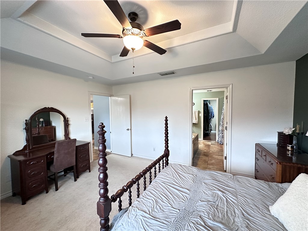 2106 Brook Lane Kingsville, TX 78363 - Photo 20 of 38 a bedroom with furniture and a ceiling fan