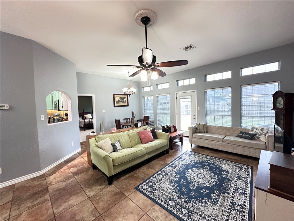 2106 Brook Lane Kingsville, TX 78363 - Photo 2 of 38 a living room with furniture and a chandelier