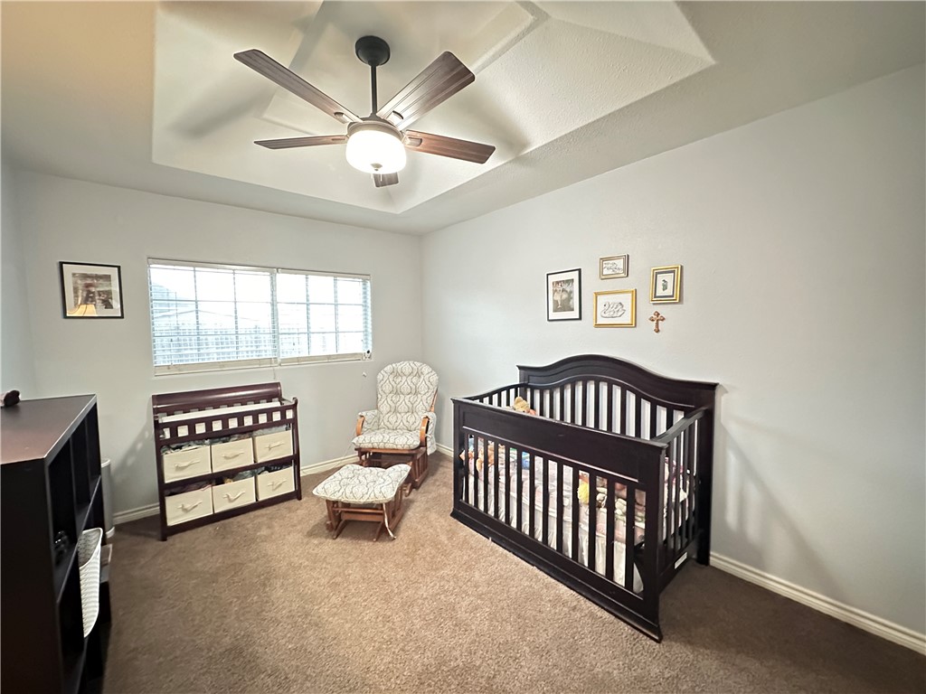 2106 Brook Lane Kingsville, TX 78363 - Photo 25 of 38 a bedroom with furniture and a window