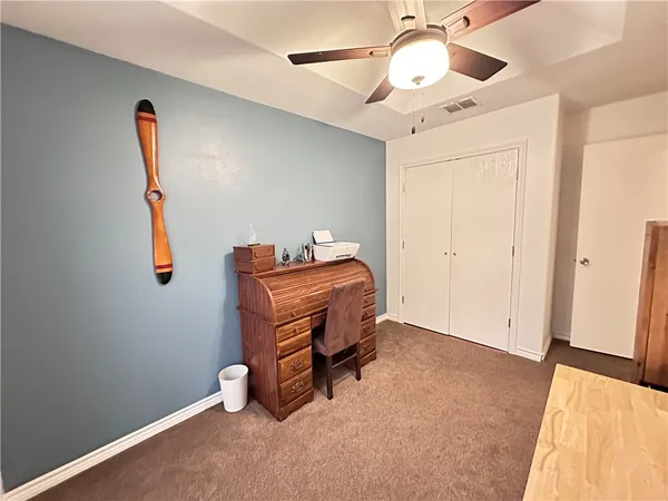 a room with gym equipment and a large mirror