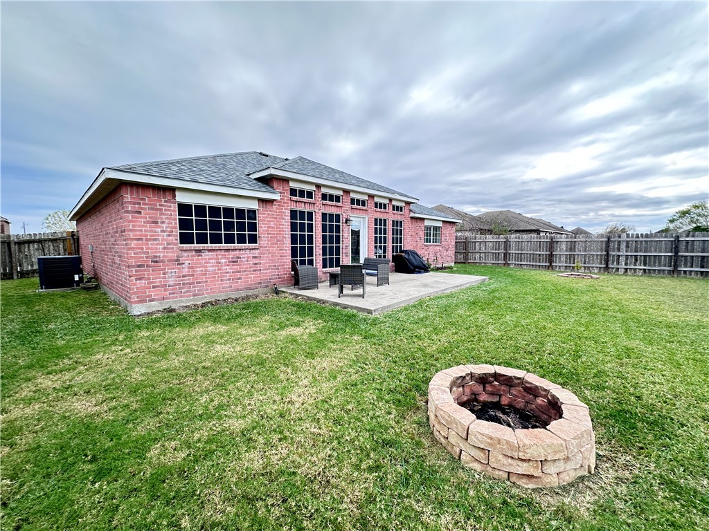 2106 Brook Lane Kingsville, TX 78363 - Photo 34 of 38 a view of a house with a backyard and porch