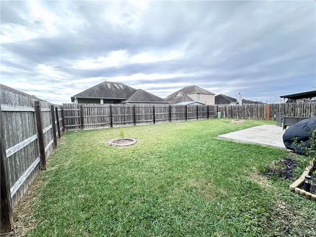 a view of a garden with a slide and a garden