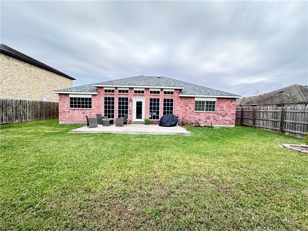2106 Brook Lane Kingsville, TX 78363 - Photo 7 of 38 front view of a house with a yard