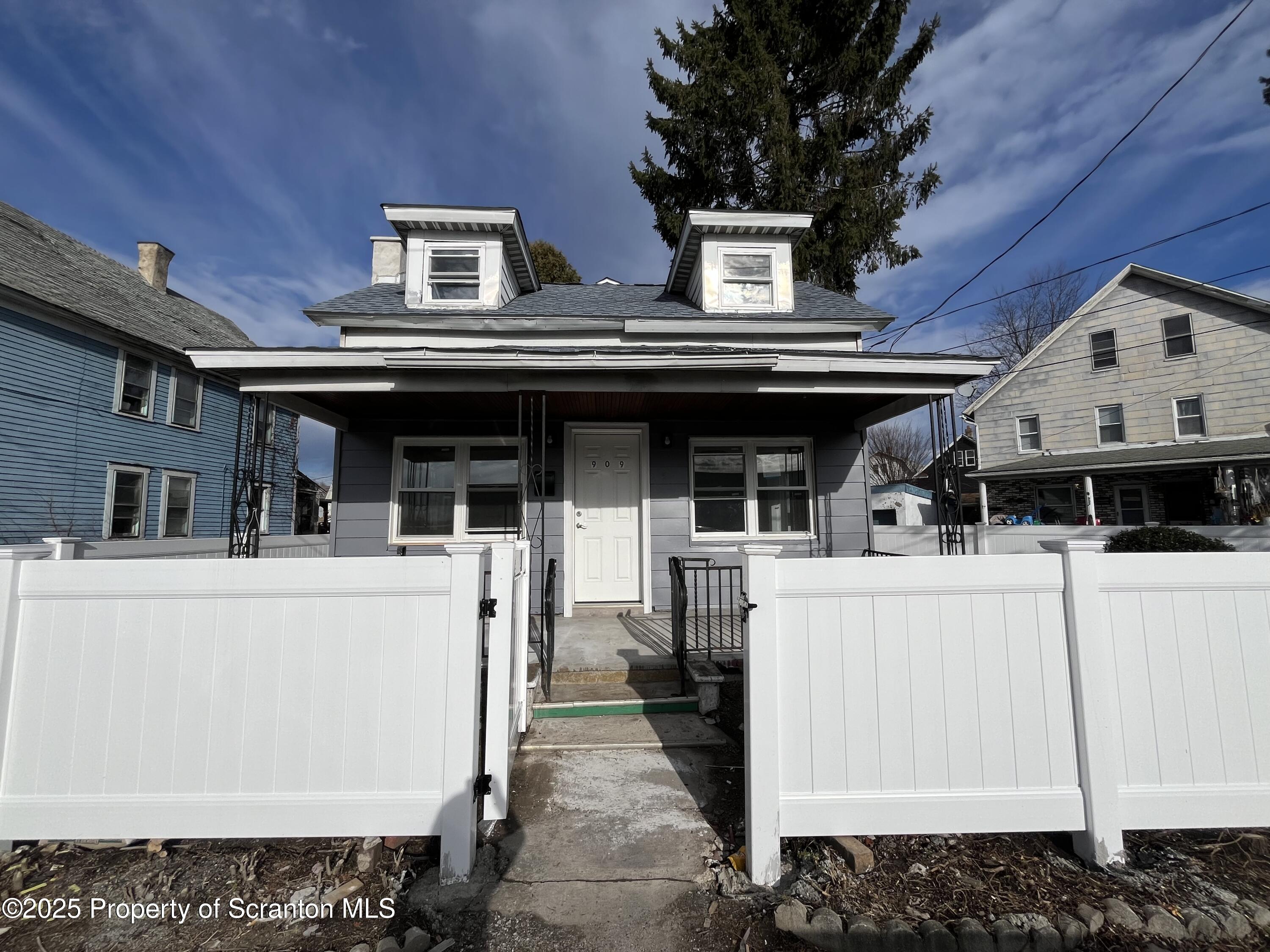 a view of house with roof deck