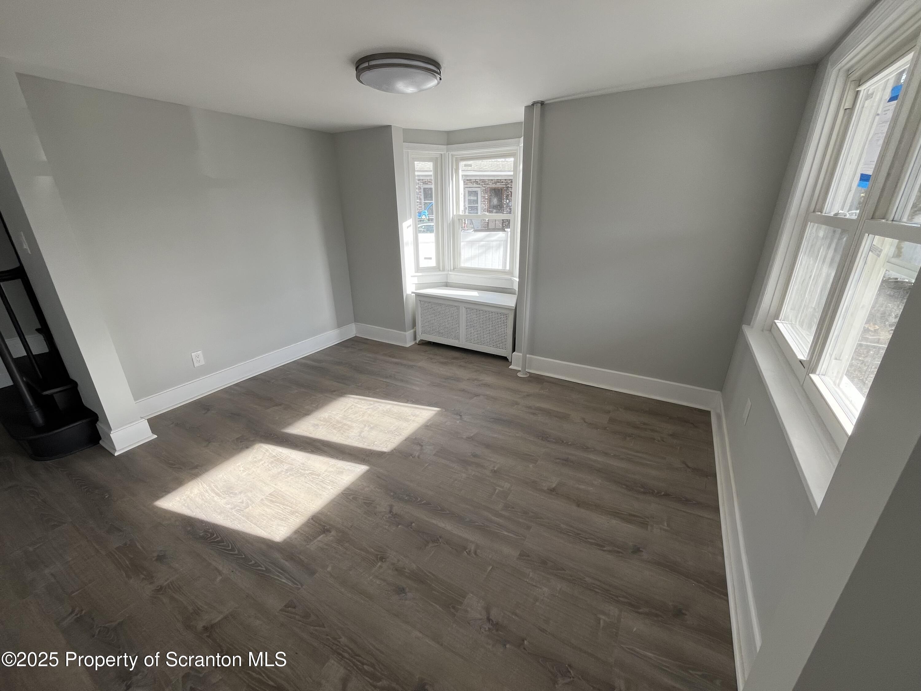 909 Battle Street Scranton, PA 18508 - Photo 3 of 13 a view of an empty room with a window