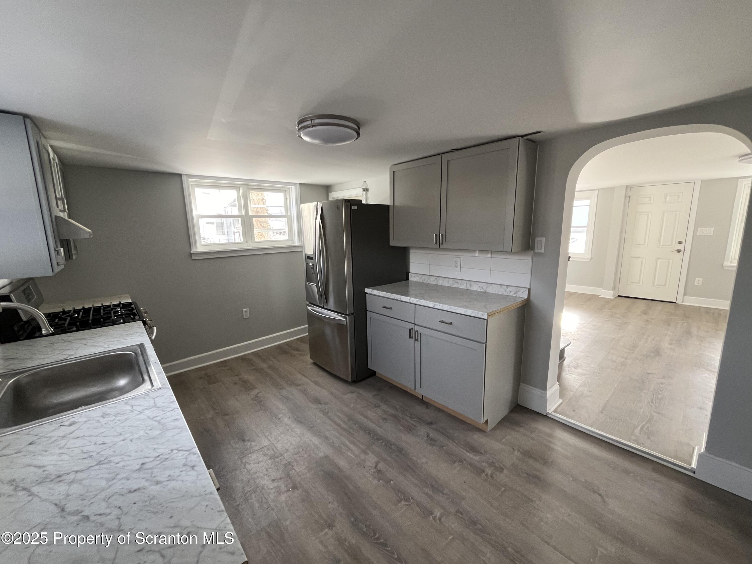 909 Battle Street Scranton, PA 18508 - Photo 6 of 13 a kitchen with a sink appliances and cabinets