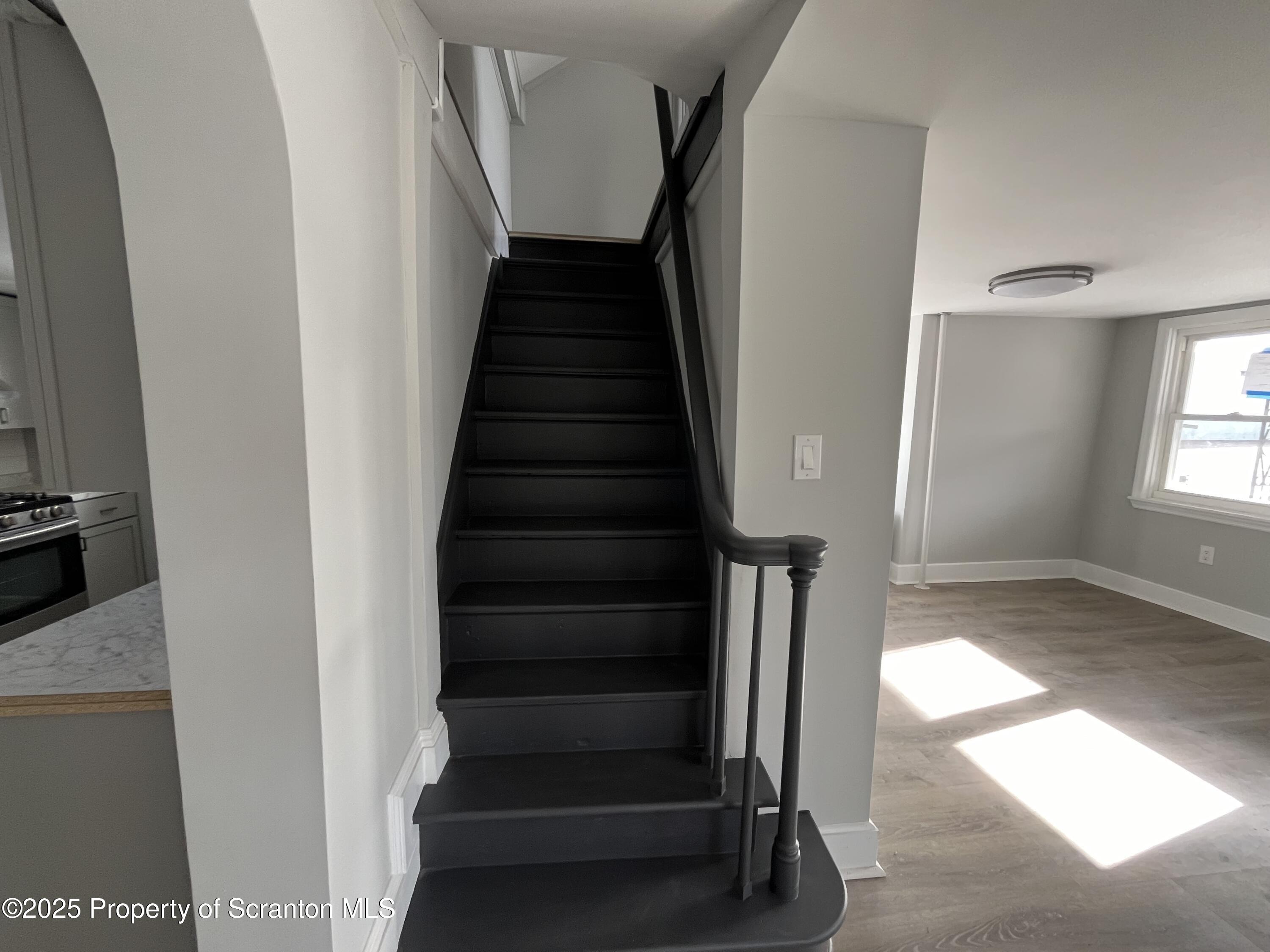 909 Battle Street Scranton, PA 18508 - Photo 9 of 13 a view of entryway and hall with wooden floor