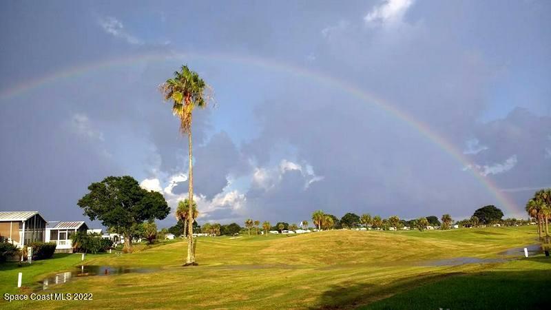 915 Fir Street Sebastian, FL 32976 - Photo 20 of 33 a view of a lake with a building in the background